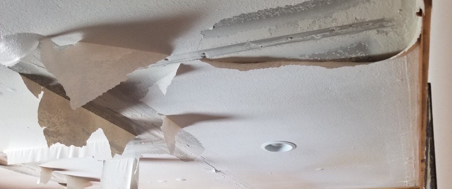 Water damage ceiling in home. Conifer Colorado American Restoration water, flood and fire damage mitigation experts. Emergency services. Water damage clean up.