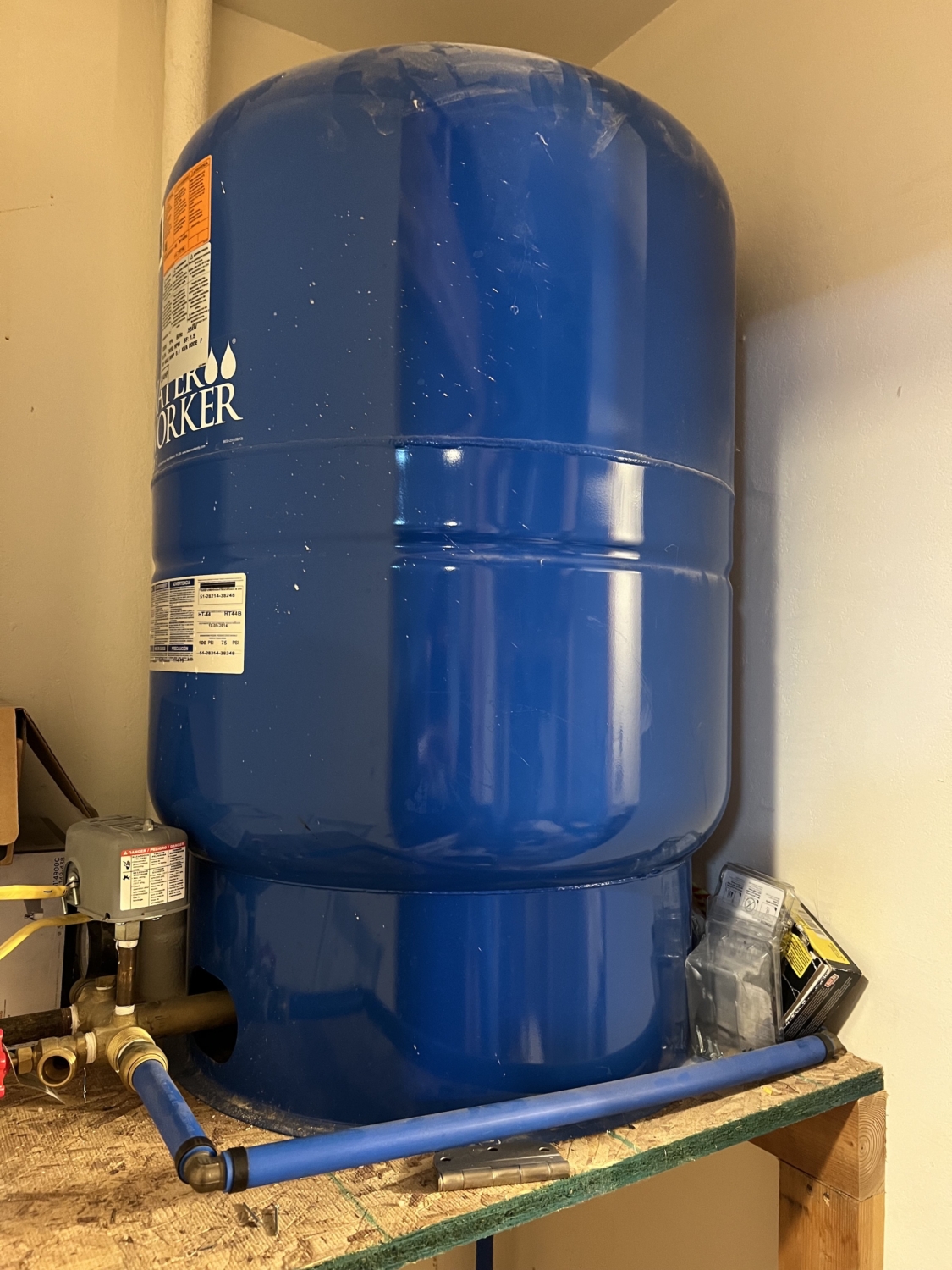 Picture of a pressure tank on a well water system. Well water shut off.  Emergency water damage.  
