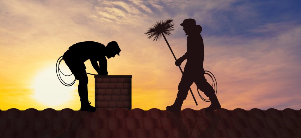 Picture of two men sweeping a chimney. Heating your home with wood or pellets can pose a risk of fire and smoke damage. American Restoration can help if you're home or commercial building has been affected by fire or smoke damage. Emergency fire and smoke damage cleanup, mitigation and restoration in Colorado.