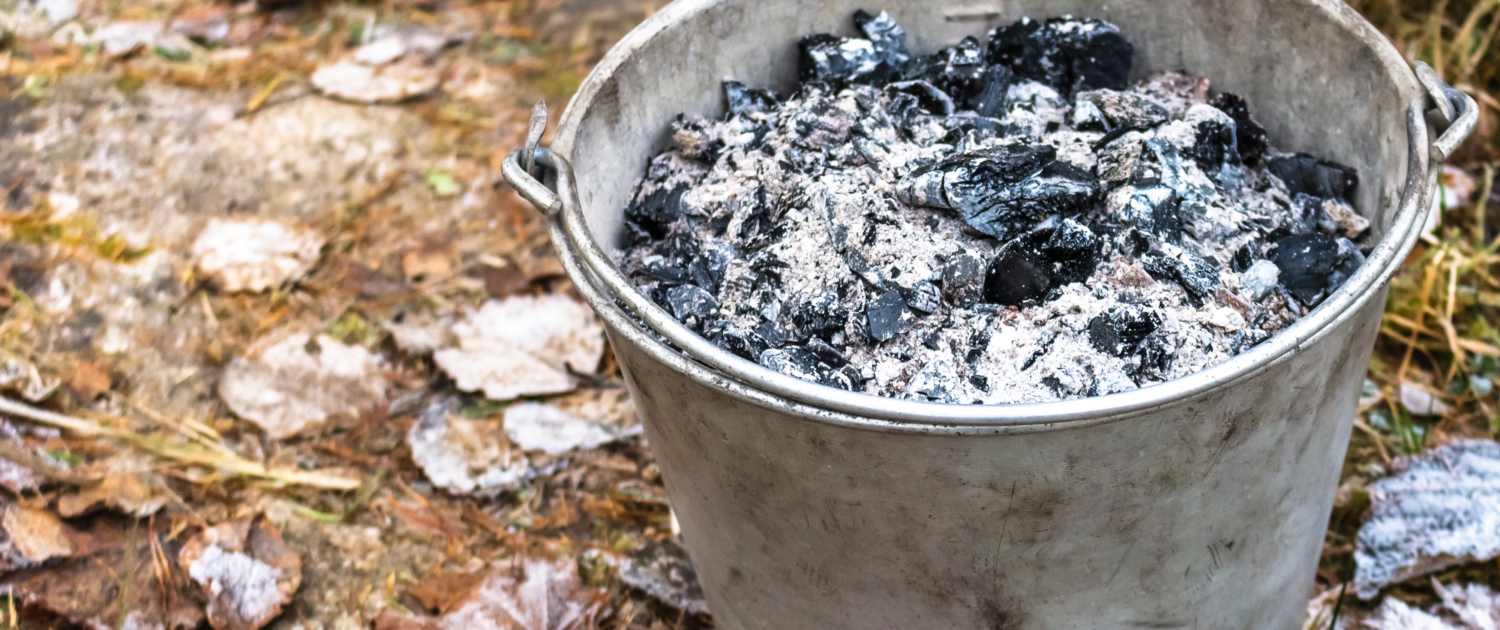 Picture of a bucket full of fireplace ash. Heating your home with wood or pellets can pose a risk of fire and smoke damage. American Restoration can help if you're home or commercial building has been affected by fire or smoke damage. Emergency fire and smoke damage cleanup, mitigation and restoration in Colorado.