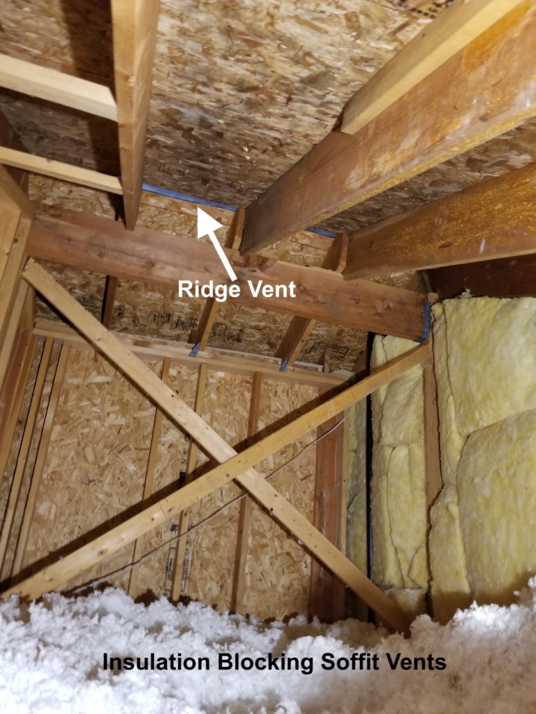 Picture of attic showing ventilation issues, blocked soffit vents causing condensation and water damage, American Restoration water damage experts